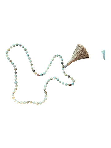 Beaded necklace with chunky stone and tassle