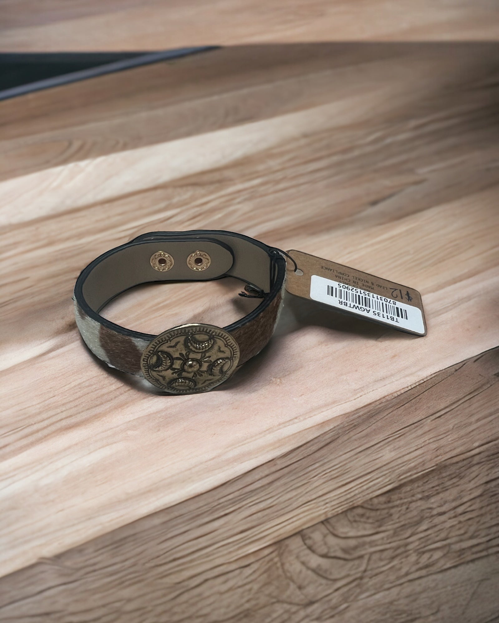 Cow print bracelet with round concho