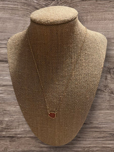 Gold necklace with pink stone