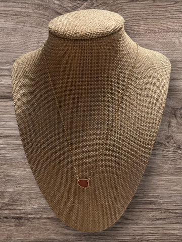 Gold necklace with pink stone